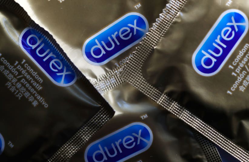 Durex condoms are seen in a photo illustration in Manchester, Britain, July 31, 2018. (photo credit: REUTERS/PHIL NOBLE)