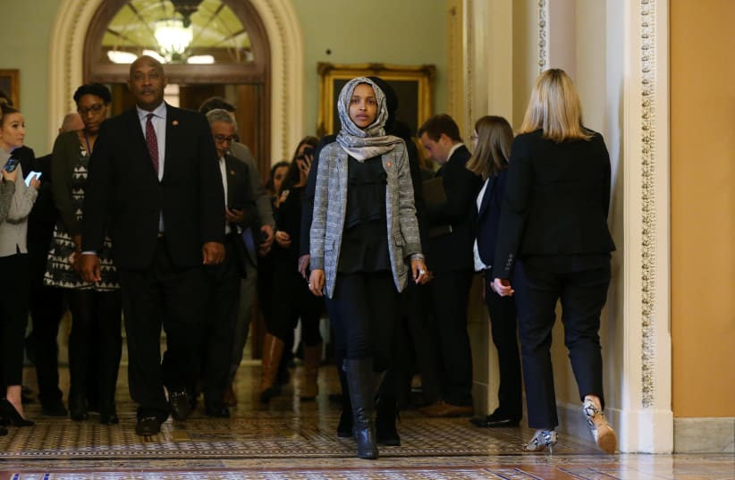 U.S. Rep. Ilhan Omar leaves Senate after watching failure of competing proposals to end government shutdown. (photo credit: LEAH MILLIS/REUTERS)
