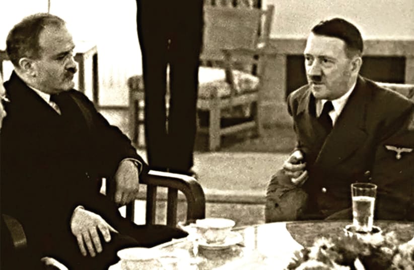 ADOLF HITLER dines with Russian foreign minister Vyacheslav Molotov in 1940. (photo credit: FLICKR)