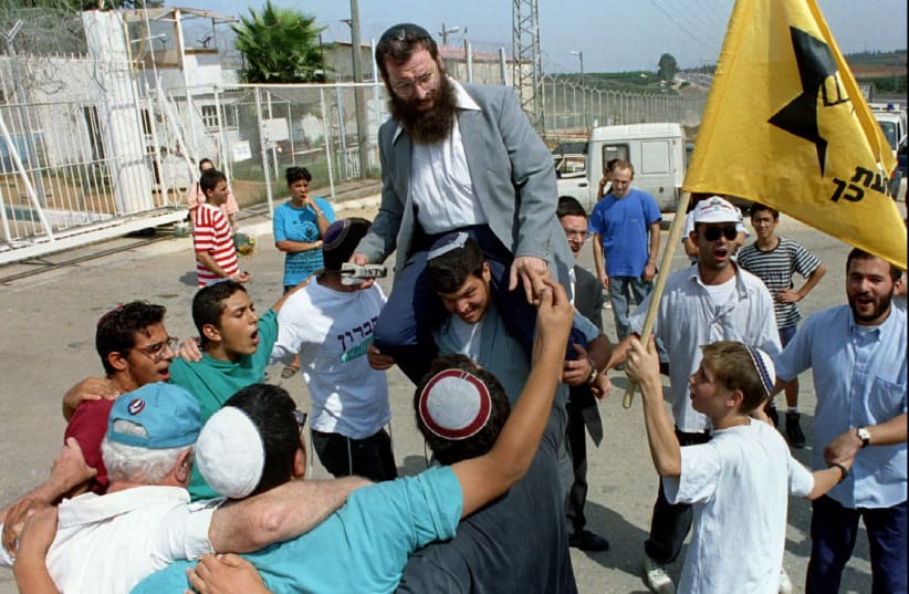 Baruch Marzel with supporters. File photo (photo credit: HAVAKUK LEVISON / REUTERS)