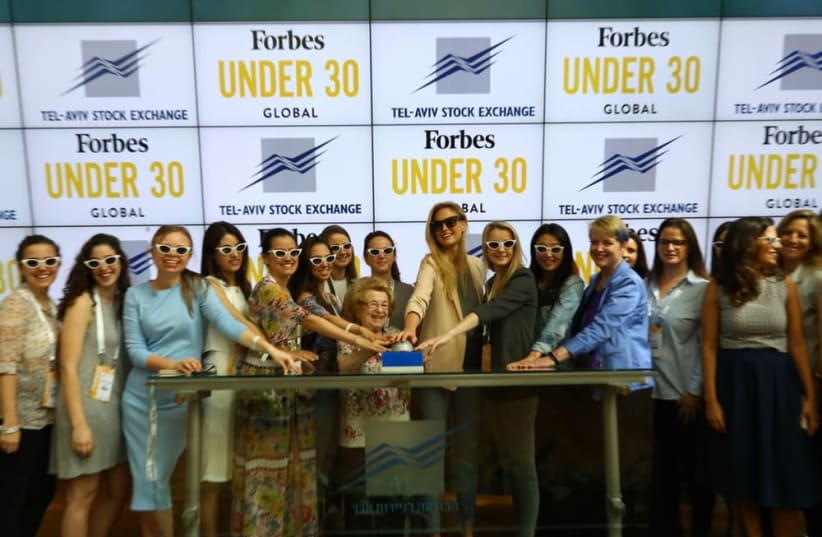 Bar Rafaeli and Ruth Westheimer, also known as Dr. Ruth, ring the opening bell at the Tel Aviv Stock Exchange during the first-ever Forbes Under 30 Summit Global in May 2018  (photo credit: PR)