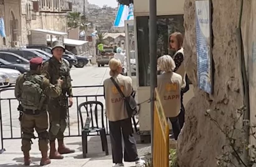EAPPI activists in Hebron  (photo credit: YOUTUBE SCREENSHOT)