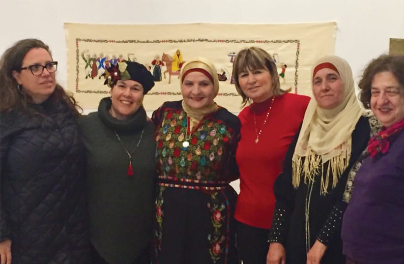 Jewish and Arab-Israeli artists have come together to produce a new exhibit: Embroidered Scaffolds. From left: Gaby Hamburg Fima, Zipy Mizrachi, Sana Abu Tir, Widad Othman, Shafika Abu Tir and Heddy Abramowitz. (photo credit: MAAYAN JAFFE-HOFFMAN)