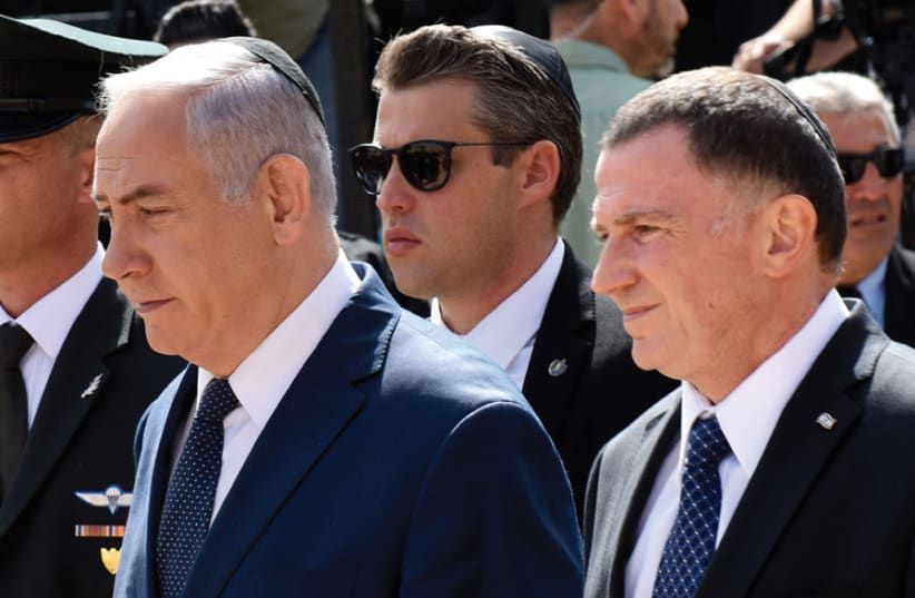 EDELSTEIN AND Prime Minister Benjamin Netanyahu arrive at the Yad Vashem ceremony marking 2018 Holocaust Remembrance Day. Coming in first in the Likud primary puts Edelstein in a prime position to take Netanyahu’s place as party leader one day. (photo credit: REUTERS)