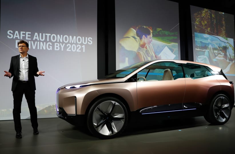 Klaus Frohlich, member of the Board of Management of BMW AG, Development, introduces the BMW Vision iNEXT electric autonomous concept car during a BMW press conference at the Los Angeles Auto Show in Los Angeles, California, U.S. November 28, 2018 (photo credit: REUTERS/MIKE BLAKE)