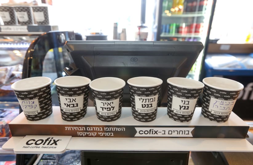 Popular budget coffee chain Cofix is holding their own poll of who will be the next prime minister using coffee cups, 2019. (photo credit: MARC ISRAEL SELLEM)