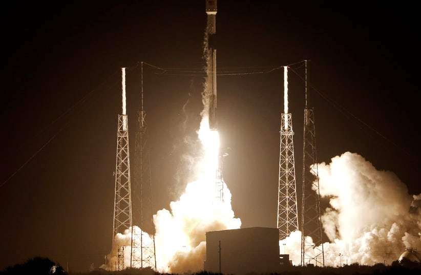 A SpaceX Falcon 9 rocket carrying Israel's first spacecraft designed to land on the moon lifts off on the first privately-funded lunar mission at the Cape Canaveral Air Force Station in Cape Canaveral, Florida (photo credit: JOE SKIPPER/REUTERS)