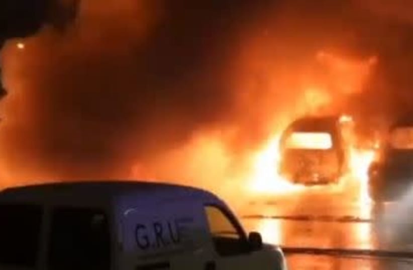 Cars on fire in Sweden (photo credit: screenshot)