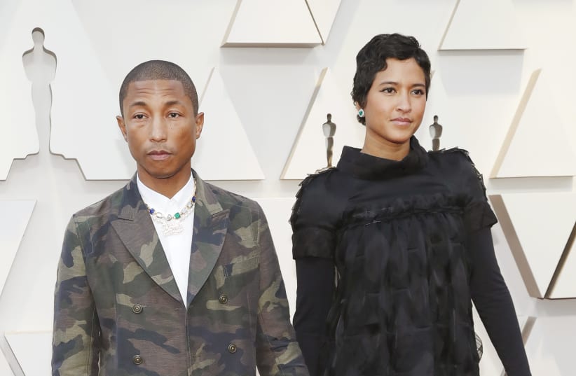 91st Academy Awards - Oscars Arrivals - Red Carpet - Hollywood, Los Angeles, California, U.S., February 24, 2019. Pharrell Williams and wife Helen Lasichanh (photo credit: MARIO ANZUONI/REUTERS)