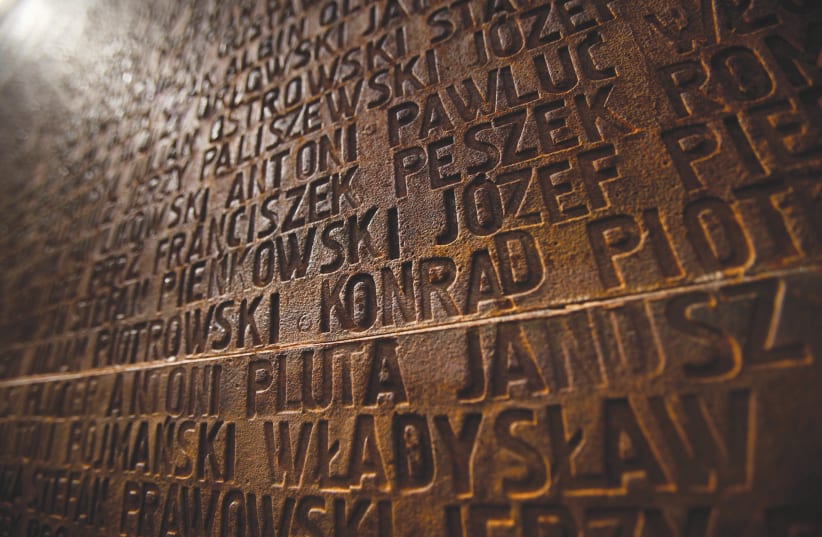 A WALL is inscribed with the names of Polish officers who died, during a commemoration ceremony at a memorial complex in Katyn forest (photo credit: REUTERS)