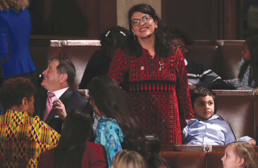 US REPRESENTATIVE Rashida Tlaib looks up into the gallery during the first session of the new Congress at the US Capitol in Washington in January (photo credit: REUTERS)