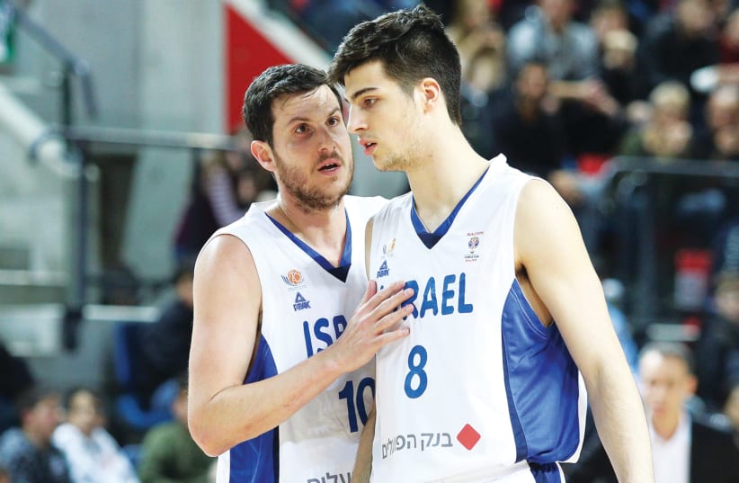 With a strong mix of veterans such as Guy Pnini (left) and young talent, like Deni Avdija (right), Israel had an up-and-down qualification campaign, which ultimately saw the-blue-and-white miss out on a spot in the 2019 FIBA World Cup. (photo credit: ADI AVISHAI)