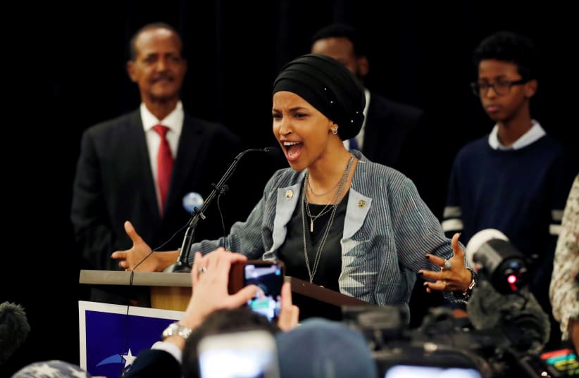 Democratic congressional candidate Ilhan Omar speaks at her election night party in Minneapolis. (photo credit: ERIC MILLER/REUTERS)