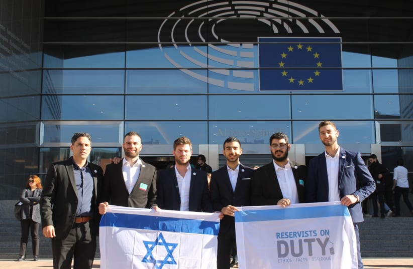 The Reservists on Duty delegation stand outside the EU Parliament in Brussels after giving testimonies for the first time (photo credit: ILANIT CHERNICK)