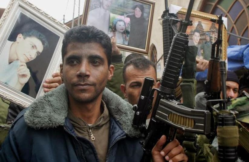 Zakariya Zubeidi, then-leader of the al-Aqsa martyrs brigades looks on during a demonstration supporting Palestinian prisoners in the West Bank city of Jenin, February 10, 2005 (photo credit: REUTERS/SAEED DAHLAN)