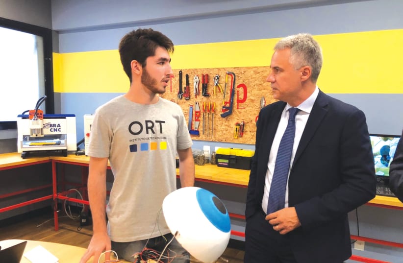 WORLD ORT director-general and CEO Avi Ganon meets a technology student at Escola ORT in Rio De Janeiro, Brazil. (Photos: Courtesy World ORT) (photo credit: COURTESY WORLD ORT)