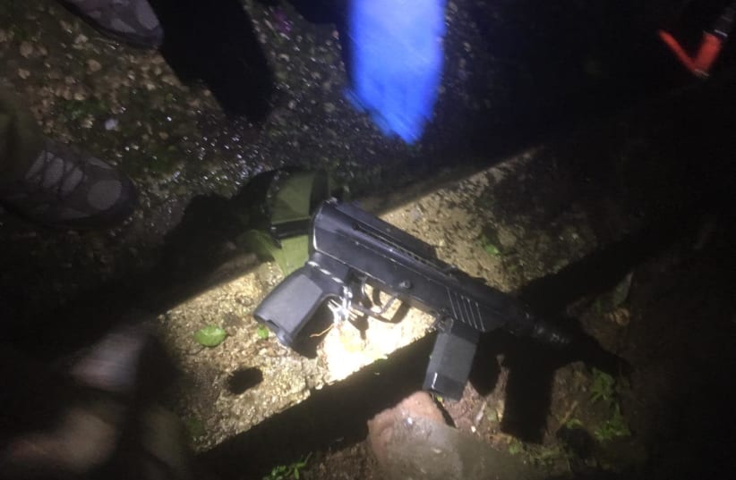 A Carlo style automatic rifle discovered in a Palestinian Authority township by IDF soldiers, February 28, 2019 (photo credit: IDF SPOKESMAN'S OFFICE)