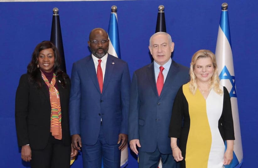 Prime Minister Benjamin Netanyahu and his wife with Liberian President George Weah and his wife  (photo credit: PMO)
