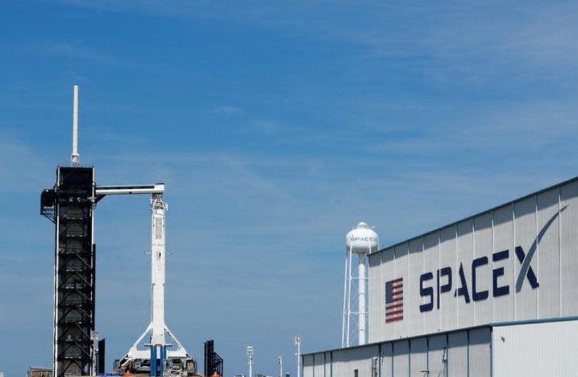 A SpaceX Falcon 9 carrying the Crew Dragon spacecraft sits on launch pad 39A prior to the uncrewed test flight to the International Space Station from the Kennedy Space Center in Cape Canaveral, Florida, U.S., March 1, 2019 (photo credit: REUTERS/MIKE BLAKE)
