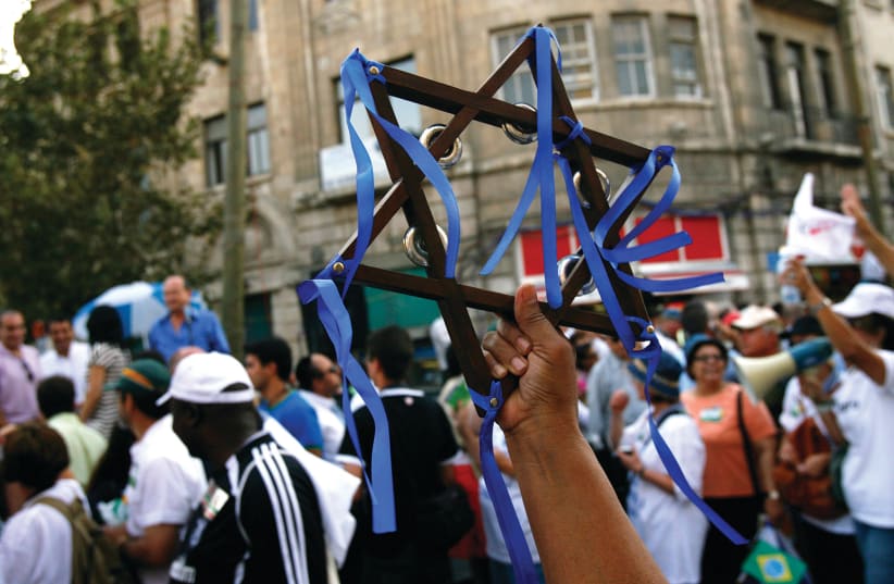 Christian supporters of Israel march in a parade. (photo credit: REUTERS)