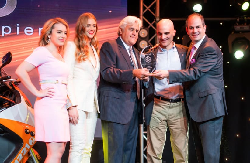 Jay Leno accepts the Humanitarian Award. (From Left) Actress Renée Willett, Esti Ginzburg, Jay Leno, Marc Gerson, Eli Beer. the 1st Annual Los Angeles Gala for Friends of United Hatzalah. (photo credit: Courtesy)