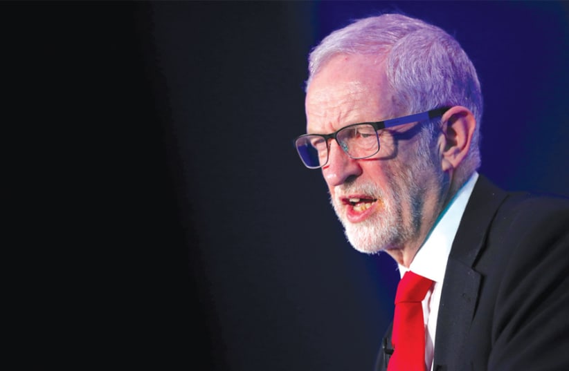 JEREMY CORBYN, leader of the Labour Party, gives a speech in London last month. (photo credit: HANNAH MCKAY/ REUTERS)