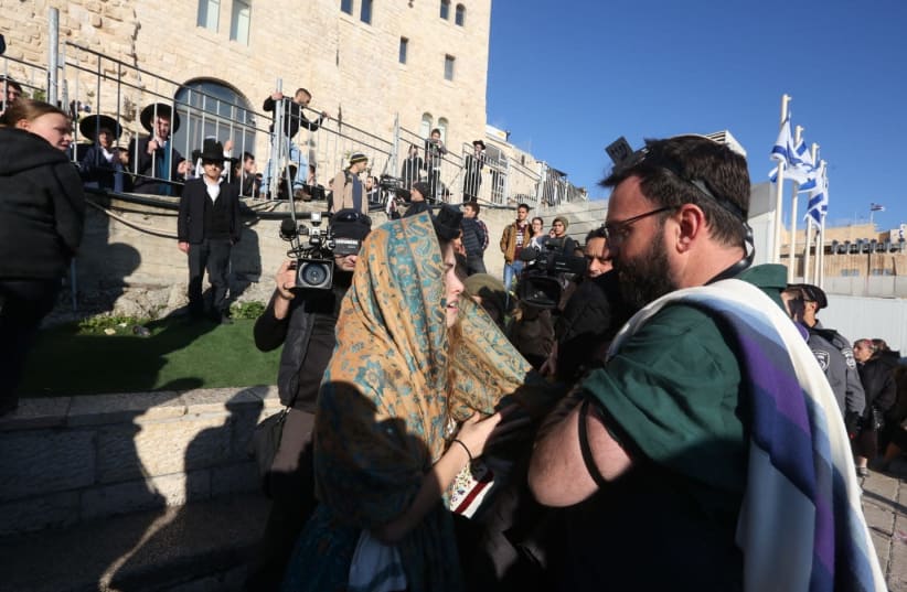 A standoff between a Orthodox man and a member of Women of the Wall takes place at the Western Wall on Friday morning. (photo credit: MARC ISRAEL SELLEM/THE JERUSALEM POST)