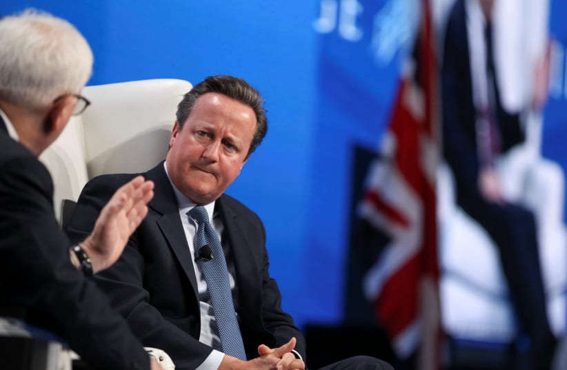 David M. Rubenstein (L), co-founder and co-chief executive officer at The Carlyle Group, holds a discussion with former British Prime Minister David Cameron during the SALT conference in Las Vegas, Nevada, U.S. May 17, 2017 (photo credit: REUTERS)