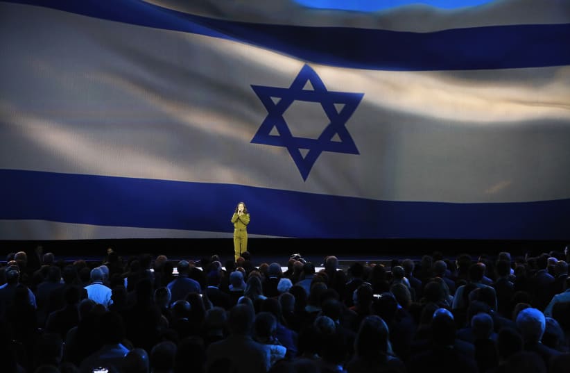 Tamar Ben-Ozer of the Israeli Defense Forces (IDF) Outstanding Musicians program sings Israel's national anthem at the American Israel Public Affairs Committee (AIPAC) policy conference in Washington, March 1, 2015 (photo credit: JONATHAN ERNST / REUTERS)