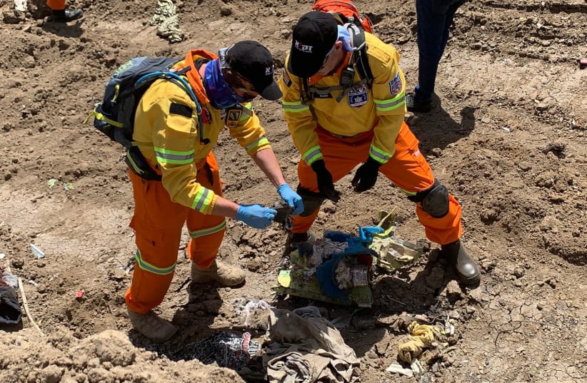 ZAKA volunteers search the crash site of Ethiopian Airlines Flight ET 302 for the remains of two Israeli victims (photo credit: ZAKA)