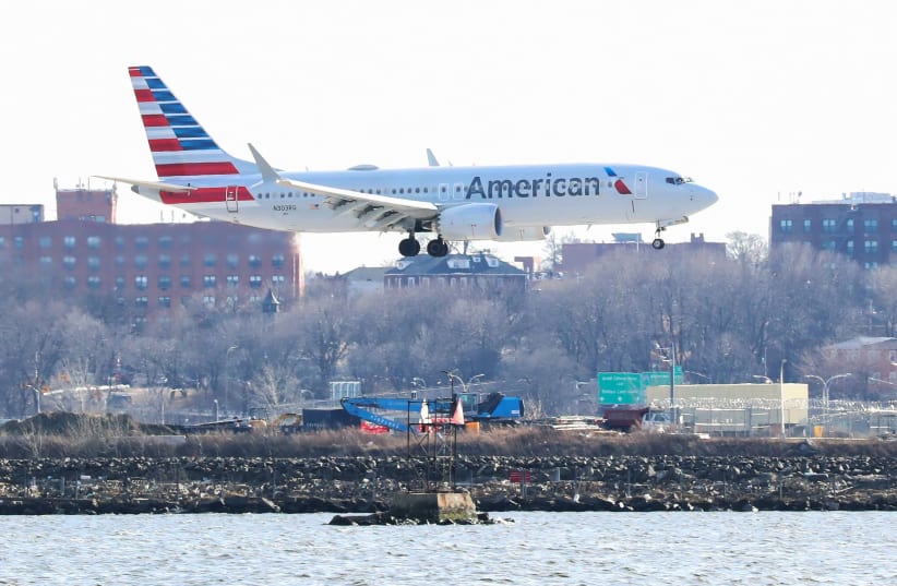 An American Airlines Boeing 737 Max 8, on a flight from Miami to New York City, comes in for landing at LaGuardia Airport in New York, U.S., March 12, 2019.  (photo credit: REUTERS/SHANNON STAPLETON)
