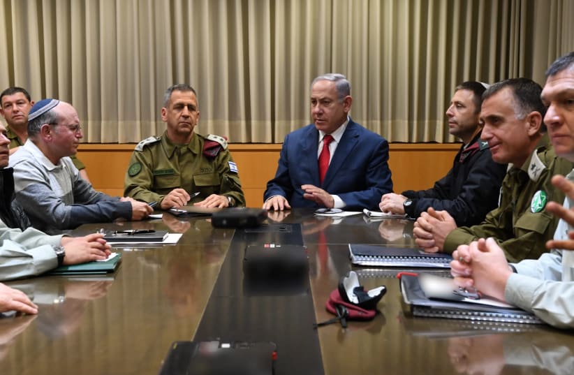 Prime Minster and Defense Minister Benjamin Netanyahu speaks to the security cabinet after convening it to discuss Gaza rockets fired at Tel Aviv (photo credit: ARIEL HERMONI / DEFENSE MINISTRY)