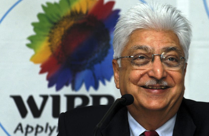 Azim Premji, chairman of Wipro Ltd., smiles during a news conference in the southern Indian city of Bangalore, October 18, 2006. Wipro Ltd., India's third-largest software services exporter, beat forecasts with a 48 percent jump in quarterly profits on Wednesday, as demand for outsourcing rose, but  (photo credit: REUTERS)