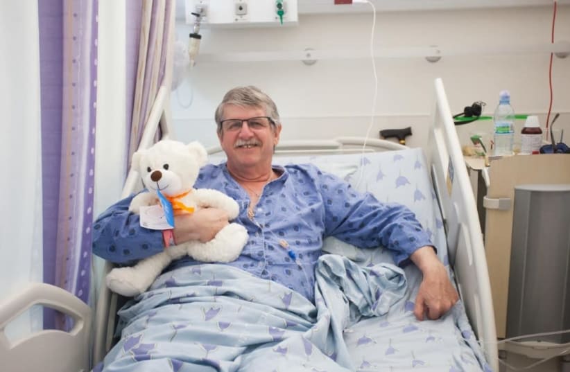  A patient at Tel Aviv's Ichilov Hospital receives a teddy bear from charity Healing Teddies  (photo credit: KARIN MAGEN)