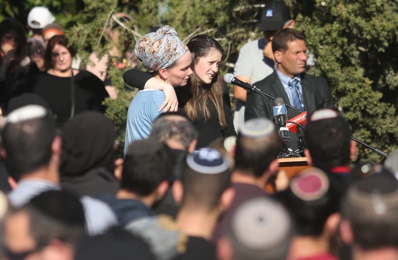 Efrat Ettinger (R) delivers a eulogy for her father, Rabbi Ahiad Ettinger, in the West Bank settlement of Eli, March 18th, 2019 (photo credit: MARC ISRAEL SELLEM/THE JERUSALEM POST)