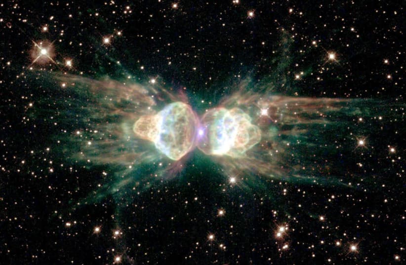From ground-based telescopes, this cosmic object - the glowing remains of a dying, Sun-like star - resembles the head and thorax of a garden-variety ant. This NASA/ESA Hubble Space Telescope image, released on February 1, 2001, of the so-called "ant nebula" (Menzel 3, or Mz3) shows even more detail, (photo credit: REUTERS)