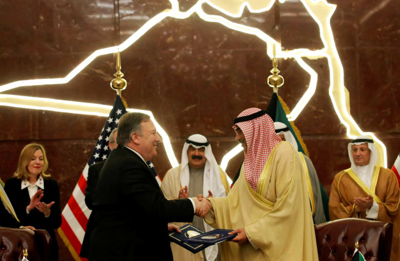U.S. Secretary of State Mike Pompeo shakes hands with Kuwait's Foreign Minister Sheikh Sabah Al-Khalid Al-Sabah in Kuwait, March 20, 2019 (photo credit: JIM YOUNG/REUTERS)