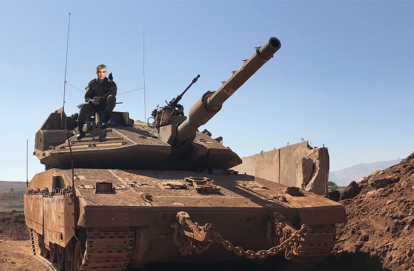 YAIR LAPID searches for the coffee machine in his IDF-assigned tank (photo credit: IDF SPOKEWHEEL)