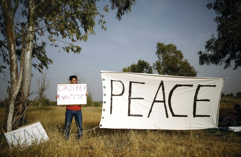 Israeli peace activist on the Gaza border. (photo credit: REUTERS)