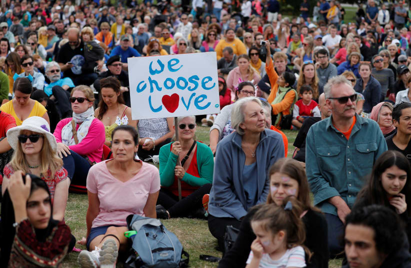 People take part in the "March for Love" at North Hagley Park after the last week's mosque attacks in Christchurch, New Zealand March 23, 2019. (photo credit: JORGE SILVA / REUTERS)