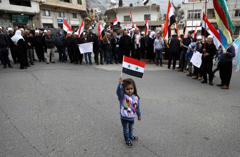 Druze people protest Trump's support for Israeli sovereignty over Golan Heights (REUTERS/Ammar Awad) (photo credit: REUTERS/AMMAR AWAD)