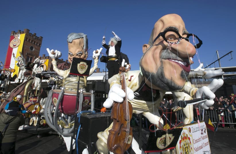 Giant figures are seen during the 87th carnival parade of Aalst February 15, 2015 (photo credit: REUTERS/YVES HERMAN)
