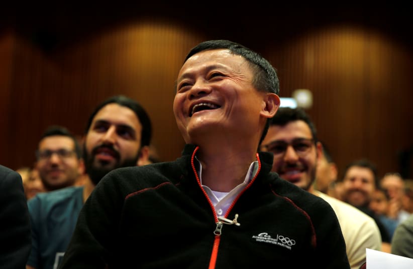 Jack Ma, founder of Chinese e-commerce giant Alibaba, laughs during an event at the Tel Aviv University, Israel May 3, 2018 (photo credit: AMIR COHEN/REUTERS)