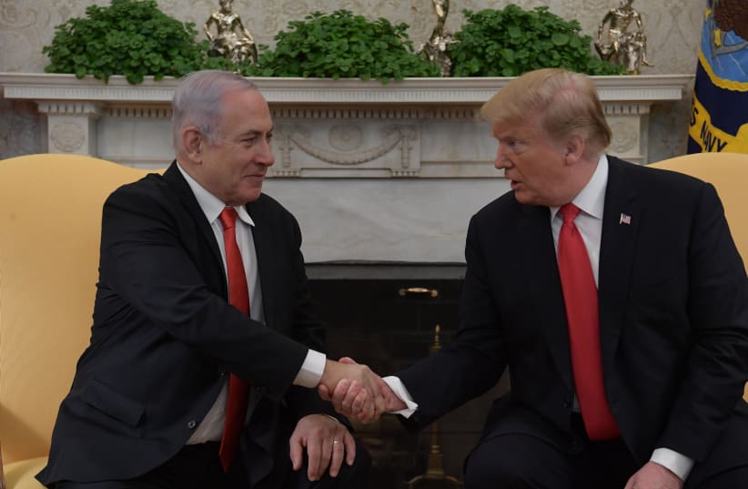Prime Minister Benjamin Netanyahu and US President Donald Trump meet in Washington, on March 25, 2019 (photo credit: AMOS BEN-GERSHOM/GPO)