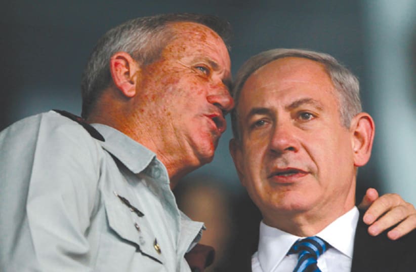 PRIME MINISTER Benjamin Netanyahu and then-IDF chief of staff Benny Gantz speak in 2013. One of them will likely be asked to form the next government (photo credit: BAZ RATNER/REUTERS)