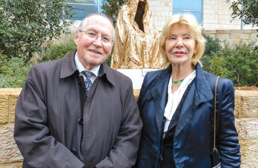 ‘CLOAK OF Conscience’: Former deputy president of the Supreme Court Elyakim Rubinstein and artist Anna Chromy stand in front of the newly inaugurated sculpture. (photo credit: ELISHA EVEN-TOV)