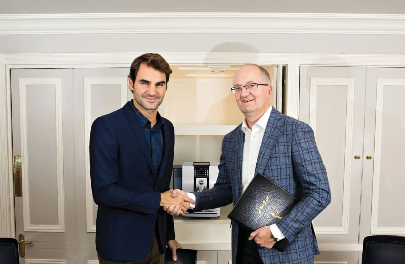 ROGER FEDERER and Jura CEO Emanuel Probst after the signing of the contract (photo credit: Courtesy)