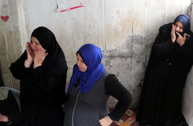 Relatives of Palestinian Mohamad Sa'ad, who was killed at the Israel-Gaza border, react during his funeral in Gaza City March 30, 2019. (photo credit: MOHAMMED SALEM/ REUTERS)