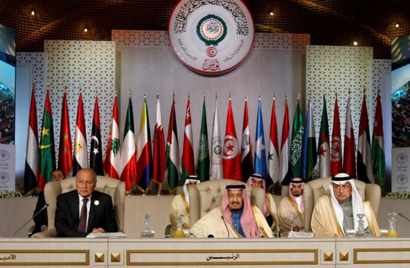 Arab League Secretary-General Ahmed Abul Gheit, Saudi Arabia's King Salman bin Abdulaziz and Saudi Arabia's Foreign Minister Ibrahim al-Assaf attend the 30th Arab Summit in Tunis, Tunisia March 31, 2019 (photo credit: ZOUBEIR SOUISSI / REUTERS)