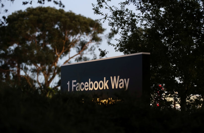 A Facebook address sign is seen at Facebook headquarters in Menlo Park, California, on Wednesday, October 10, 2018 (photo credit: ELIJAH NOUVELAGE / REUTERS)